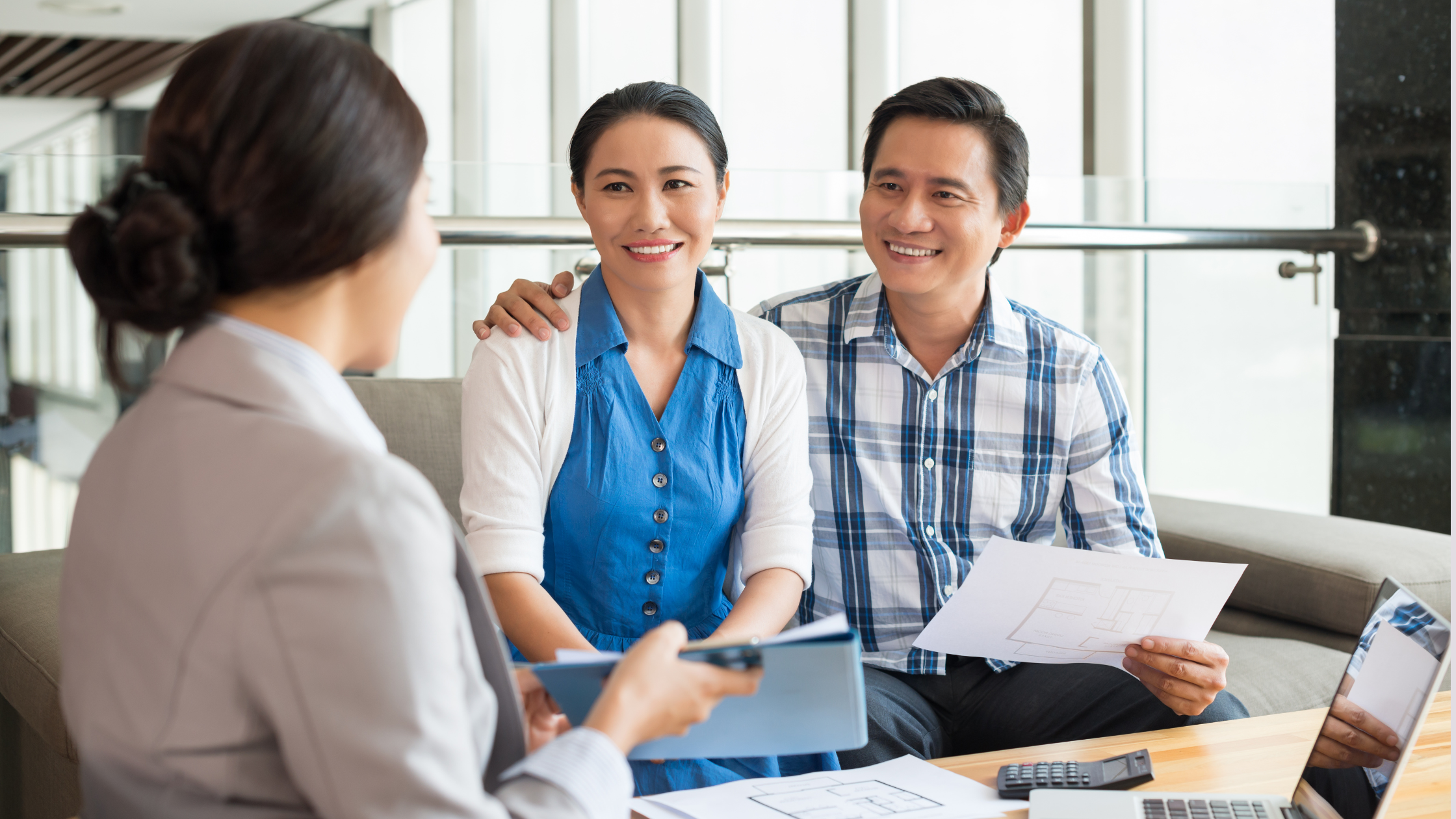 Couple sitting with an attorney to work our their estate plan