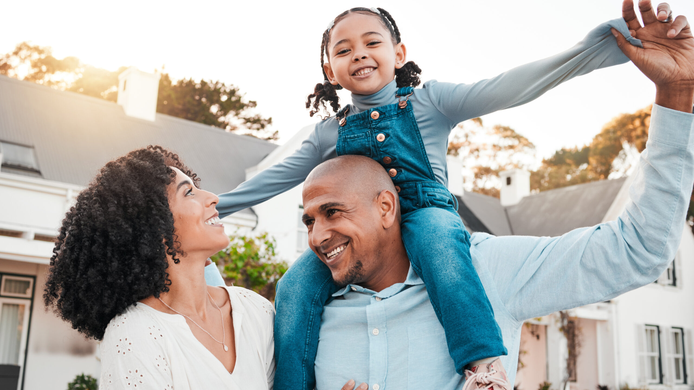 Couple with their child smiling together