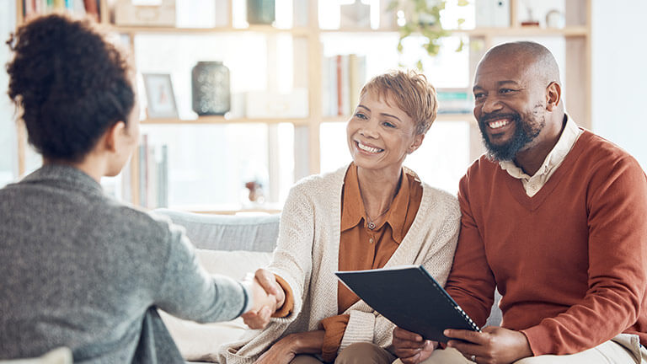 Couple speaking with a lawyer