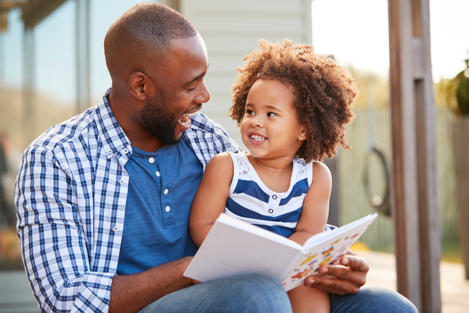 Father reading book to child